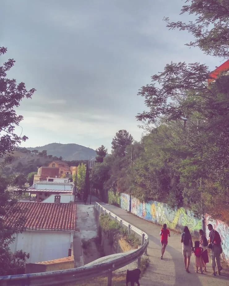 People walking mountain against sky